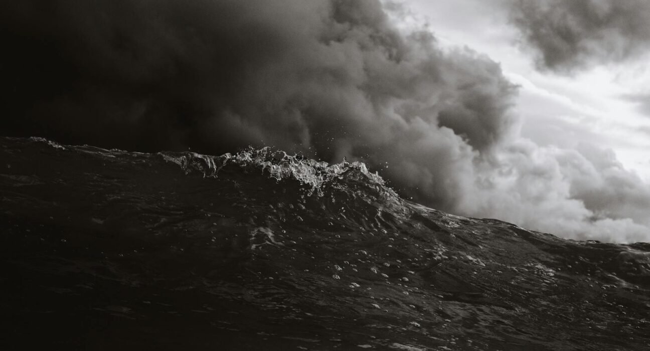 grayscale photo of body of waves
