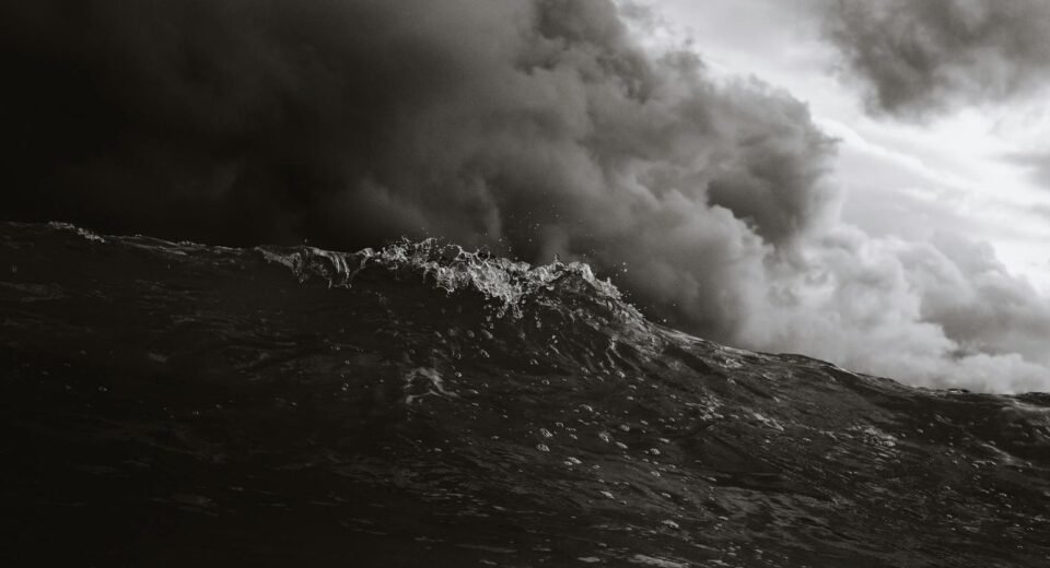 grayscale photo of body of waves
